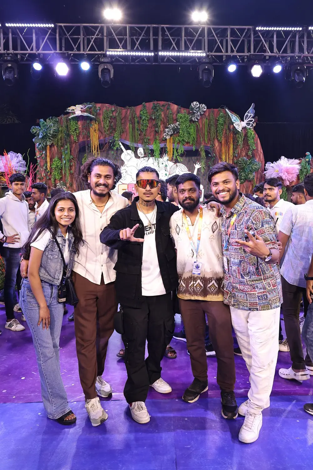 TNP team with artists on a live music stage